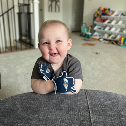 Infant wearing UTSA Go Roadrunners baby mittens in blue