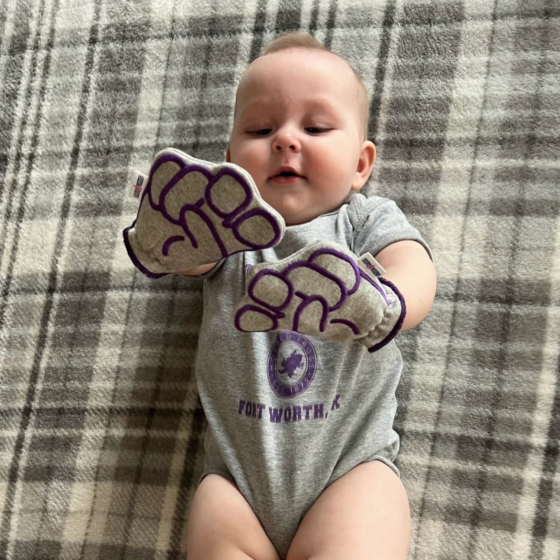 Infant wearing TCU Go Frogs baby mittens in gray